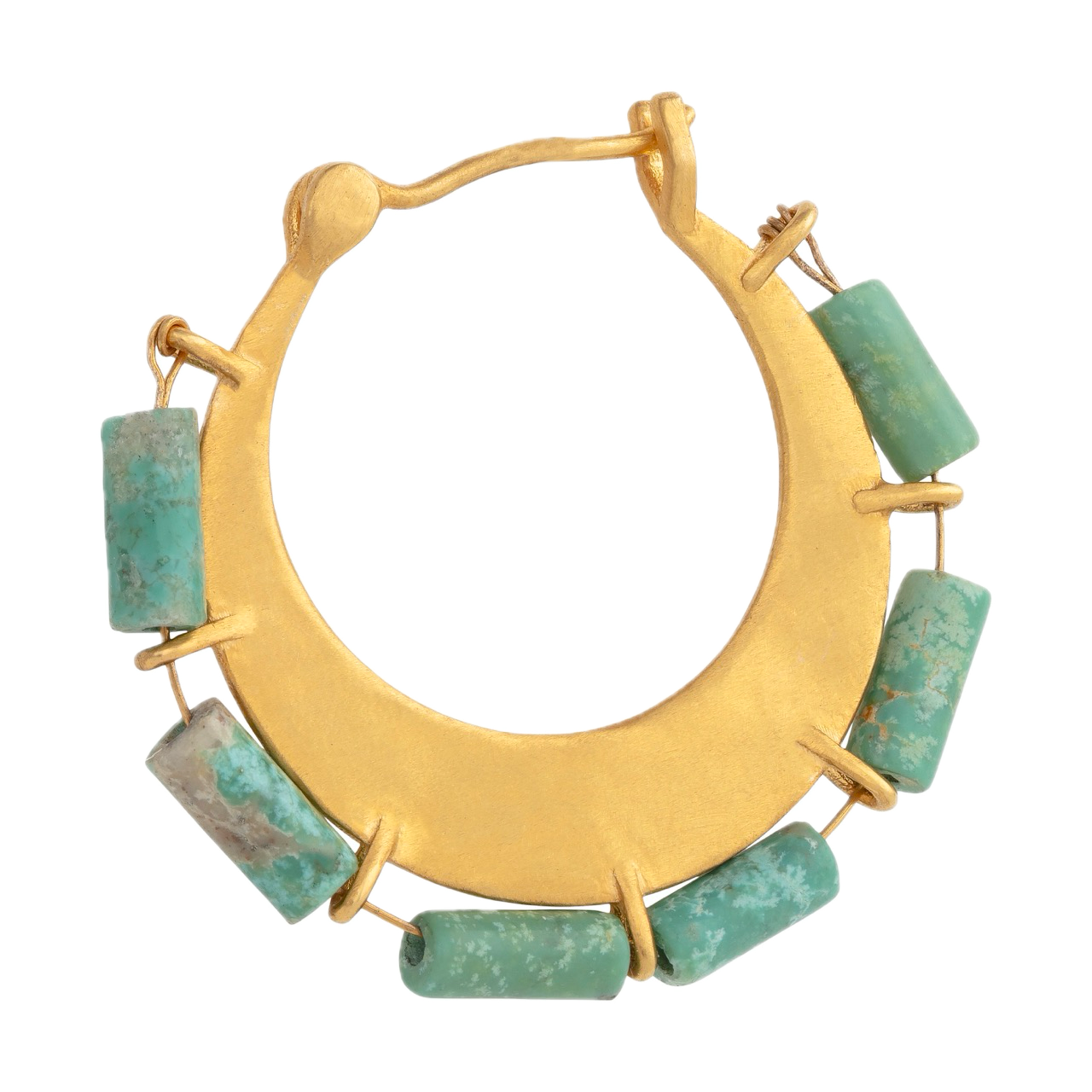 Ancient gold crafting tools on a wooden table